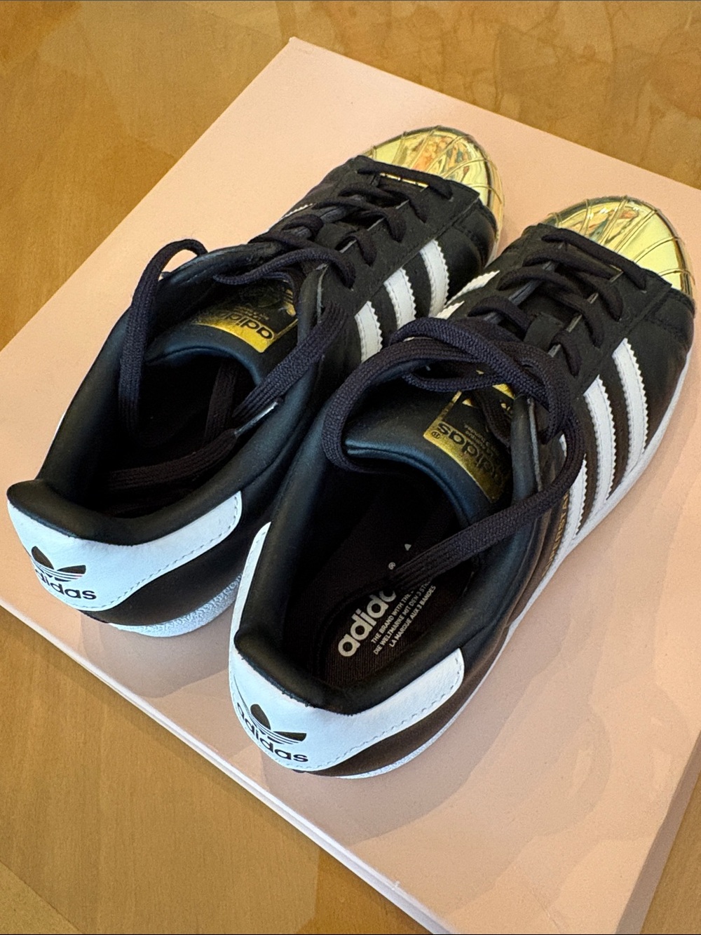 adidas Black&White Sneakers with Gold Shell Toe.  Gently used & great condition!